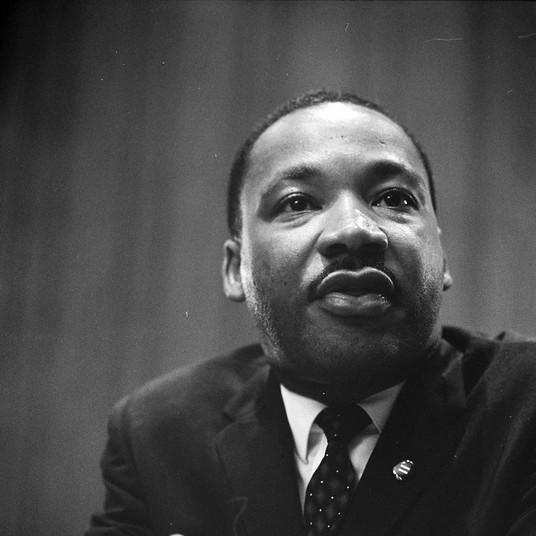 black and white photo of Martin Luther King, Jr, looking upward